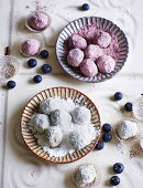 Blueberry truffles with cinnamon liqueur in icing sugar