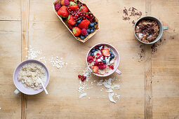 Natural porridge with berries and coconut, and with chocolate and bananas