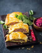 Family-sized pork sausage roll with sautéed cabbage