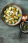 Potato, soft-boiled egg and mixed herb salad