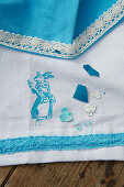 Tablecloth and napkin with lace trim and rabbit motif