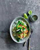 Spicy prawn and pineapple poke bowl with white rice, and coconut