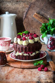 Chocolate cake with cream cheese and raspberries