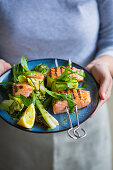Salmon skewers with wild garlic, courgettes and spring onions