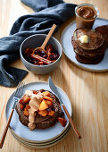 Rye and buckwheat pancakes with apple and cranberry compote, and date and almond butter