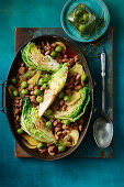 Braised Borlotti beans with cabbage and italian sausage