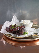 Sticky ribs with hoisin sauce served with rice