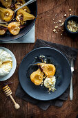 Roast pears with honey labne and candied hazelnuts