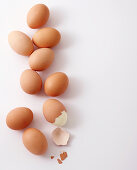 Boiled brown eggs on a white background