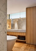 Designer bathroom in Carrara marble and oak wood