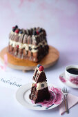 A heart-shaped chocolate cake with vanilla cream and berries for Valentine's Day