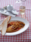 Braised chicory served with bread