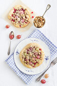 Summer yeast dough cakes with gooseberries, redcurrants and oat crumbles