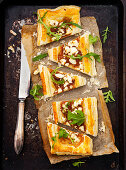 A savory puff pastry tart with caramelised onions and goat's cheese
