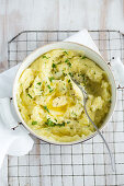 Homemade mashed potatoes with butter in a pot