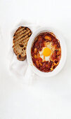 Baked eggs with tomato and sweet peppers