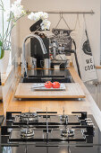 Kitchen counter with gas hob, wooden worksurface and sink