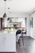 Marble kitchen island under pedal lights