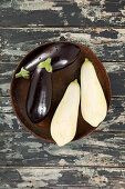 Aubergines, whole and halved