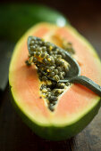 Half a papaya with seeds (close-up)