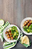 Greek salad and chicken skewers