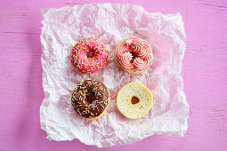 Mini doughnuts with chocolate, icing and sugar sprinkles
