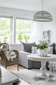 White pedestal table in grey-and-white living room