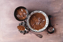 Chocolate pudding with cocoa powder and cocoa nibs