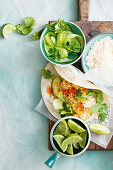 Coconut and lime fish tacos with cucumber salad