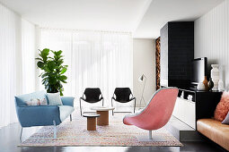Lounge with designer armchairs, sofa and chairs