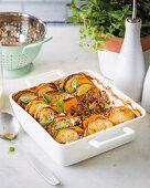 Mince casserole topped with sliced vegetables