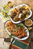 Cajun prawns with mango, lime and coconut salsa, Butterflied chicken with pistachio butter