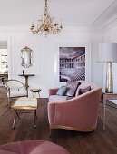 Elegant sofa, tray table with golden edge and Gustavian chair in the living room