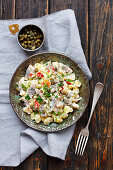 Potato salad with herring, capers and apple, mayo sauce