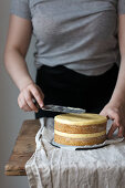 An orange cake layered with cream