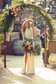 A bride wearing a high-cut wedding dress with a lavish bouquet