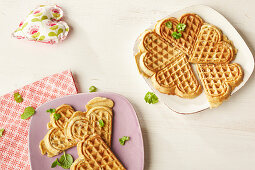 Ham and herb waffles on plates
