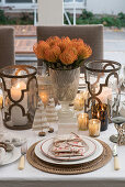 Festively decorated Christmas table set in white with metallic accents