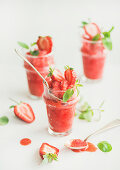 Healthy low calorie summer treat, Strawberry and champaigne granita, slushie or shaved ice dessert in glasses with mint