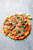 Pizza with sweet potato, prosciutto and rocket