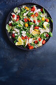 Blistered tomato and chicken couscous salad