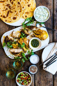 Masala chicken with herb chutney and mint raita (India)