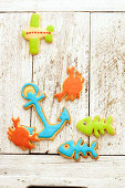 Colorful biscuits in the form of fish, anchors, crabs and an airplane