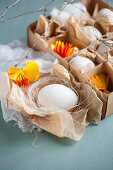 White eggs and yellow paper rosettes