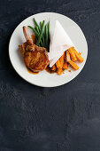 Orange-glazed pork with italian sweet potato chips