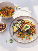 Grilled aubergine with red lentils, yoghurt and pesto