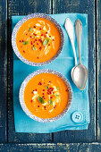 Cream of tomato soup with pink peppercorns