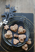 Gluten-free, heart-shaped honey biscuits decorated with white chocolate