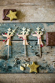 Festive reindeer decorations for cake or cookies with chocolates and fondant stars