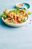 Barbecue salt and pepper prawns with avocado and snow pea sprouts